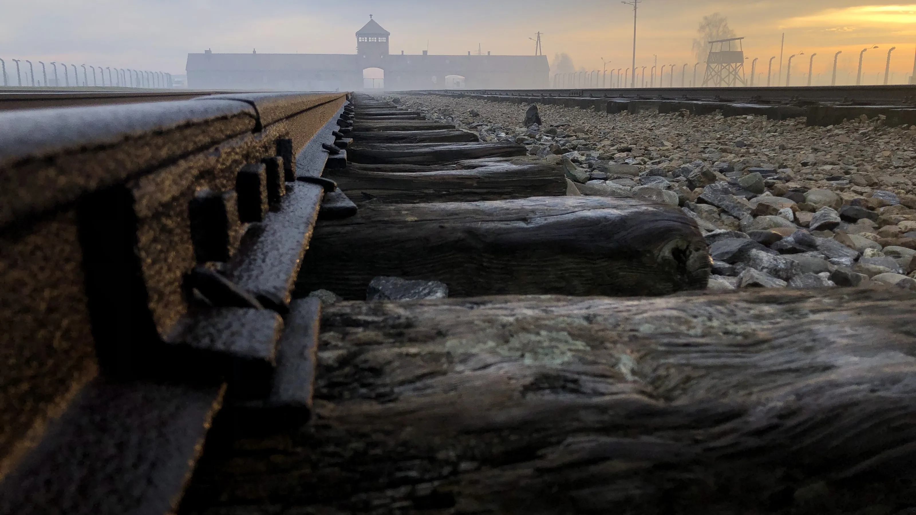 The railway line into Auschwitz II-Birkenau at sunset
