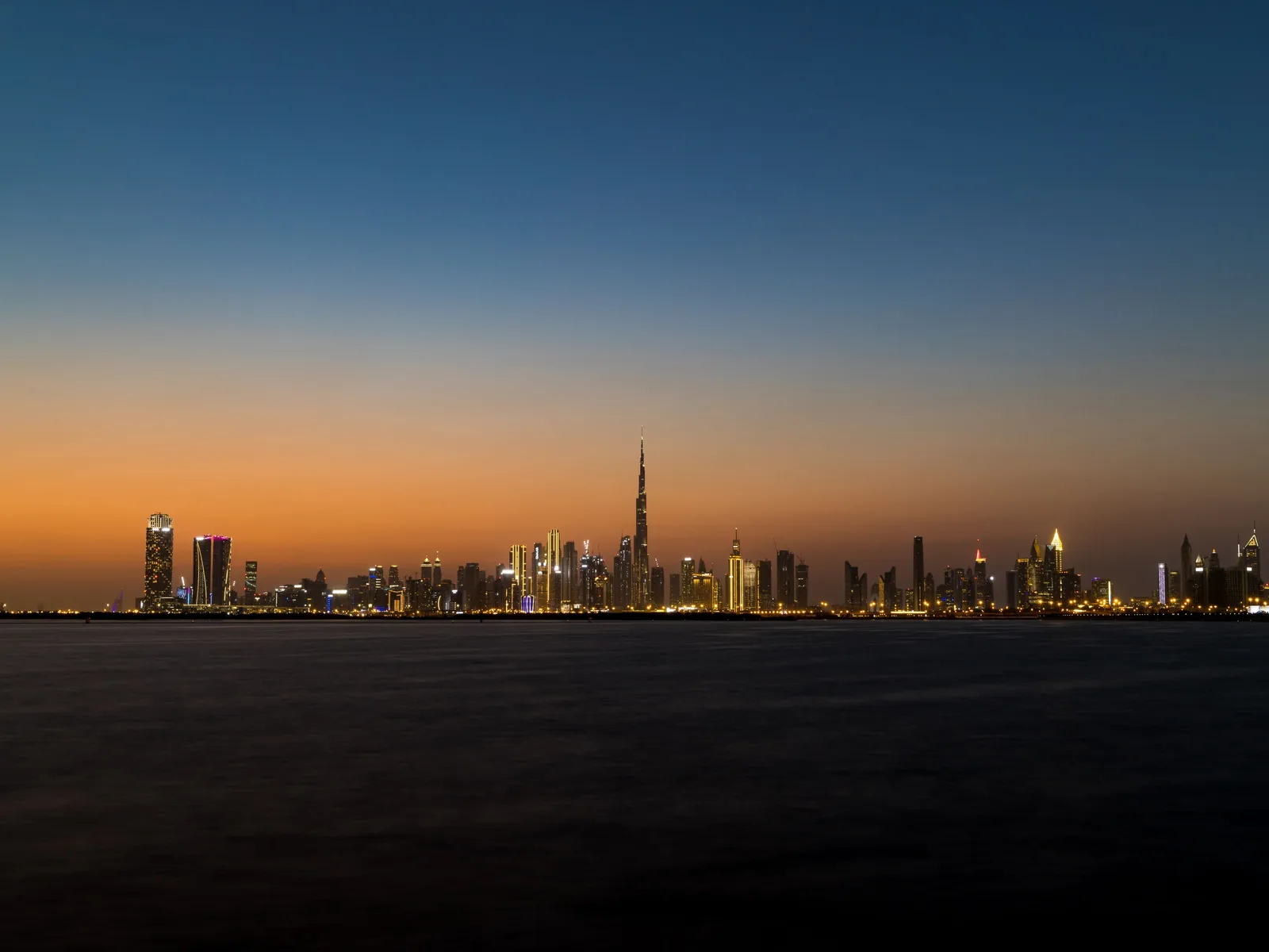 Stunning view of Dubai's skyline at twilight featuring the iconic Burj Khalifa