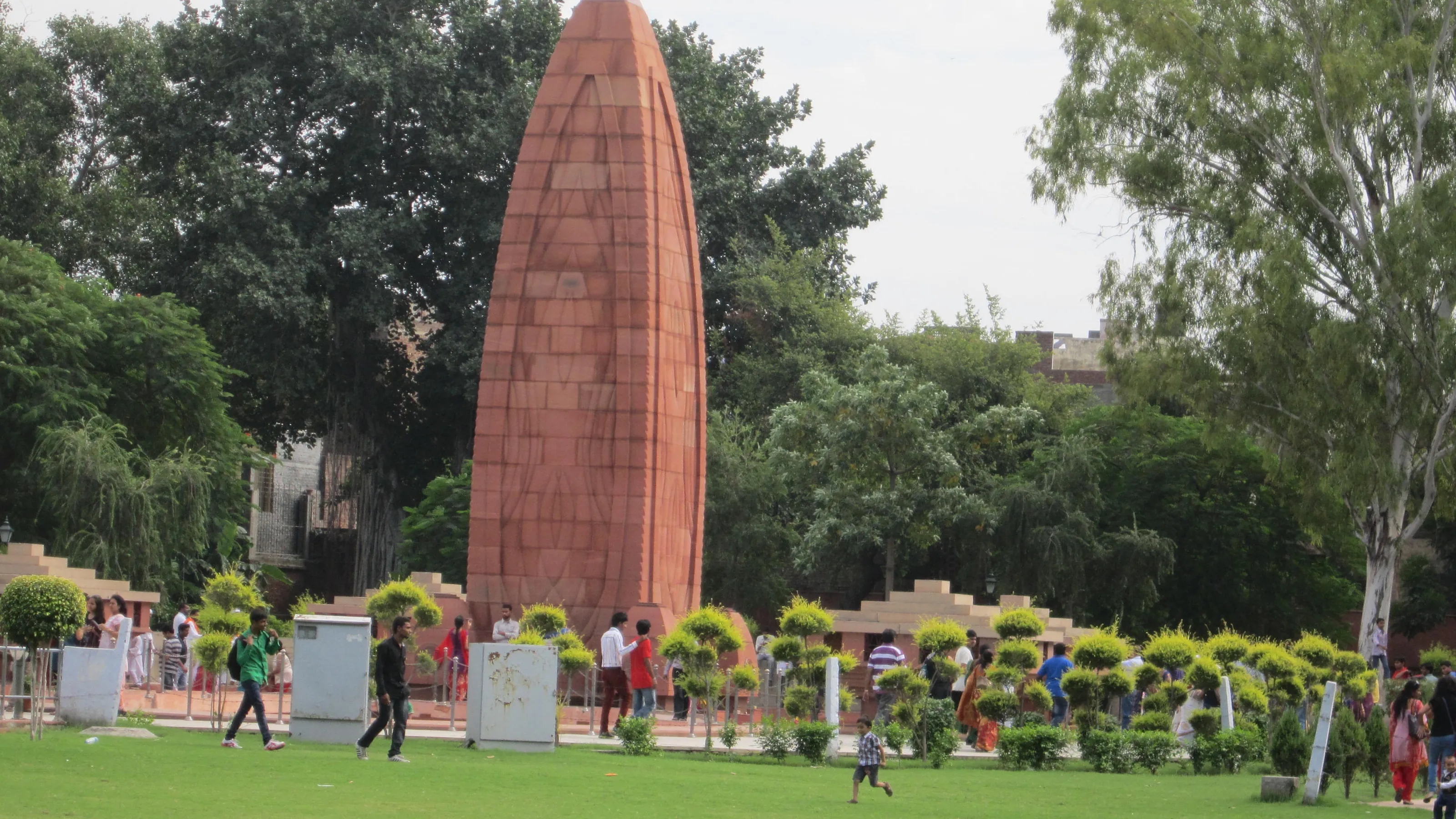 The Jallianwala Bagh memorial flame among the garden's lawns, Amritsar