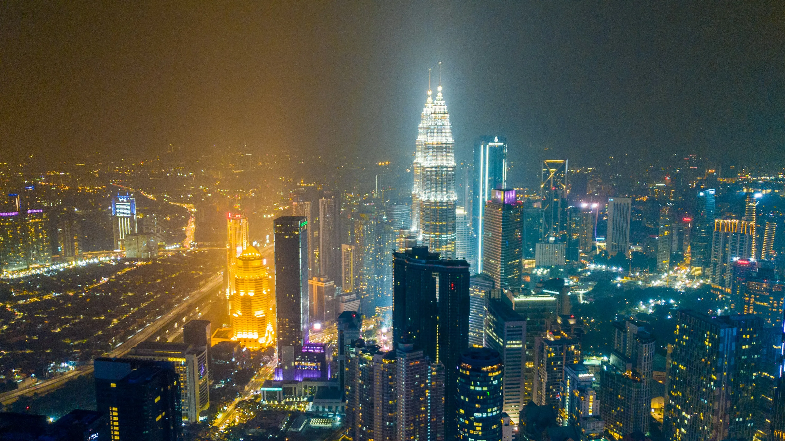 Kuala Lumpur and the Petronas Towers at night, from the air
