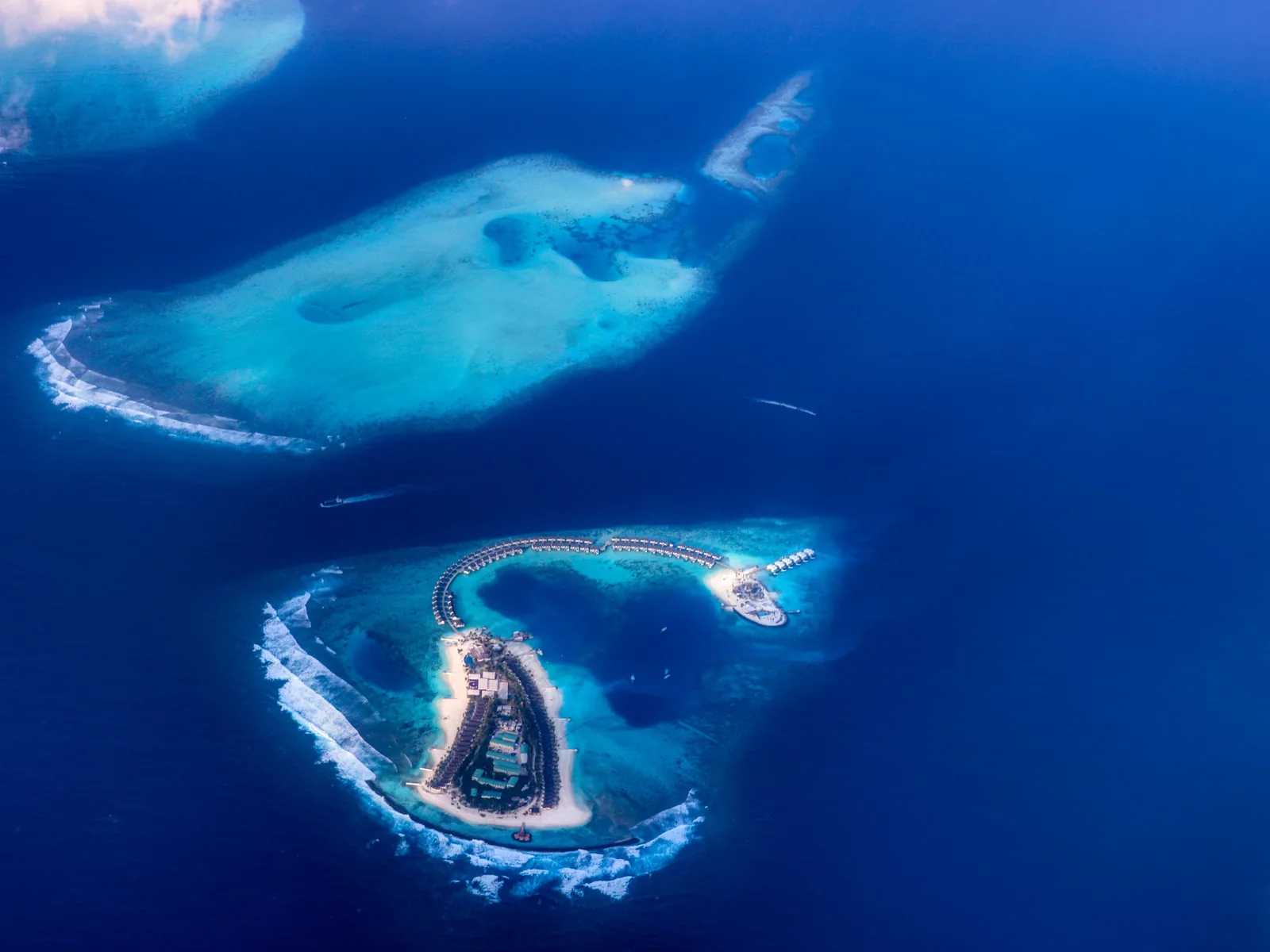 Stunning aerial view of turquoise waters and islands in the Maldives