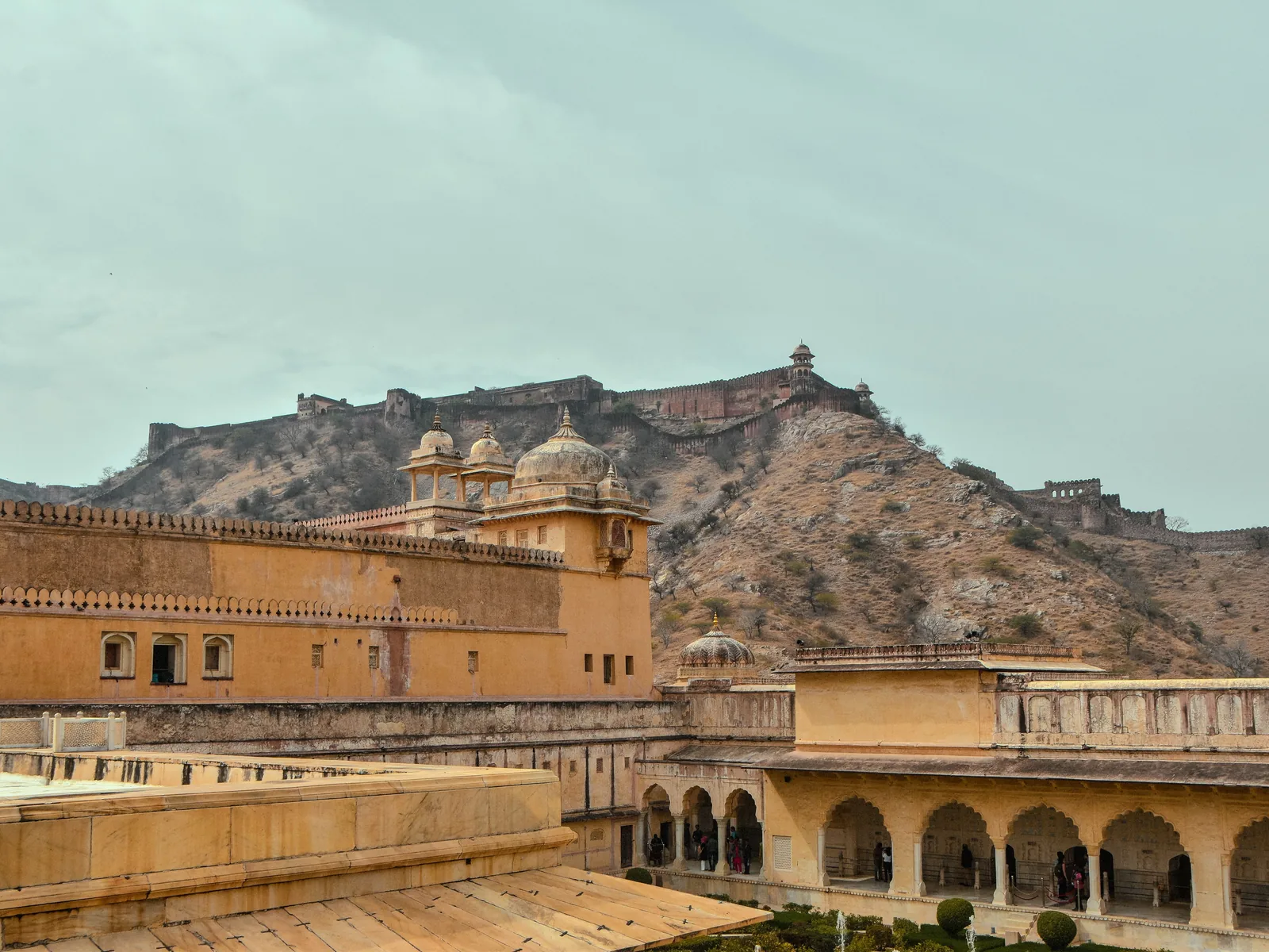 A picturesque view of the historic Amer Fort located in Jaipur, India, with its stunning architecture and surrounding hills