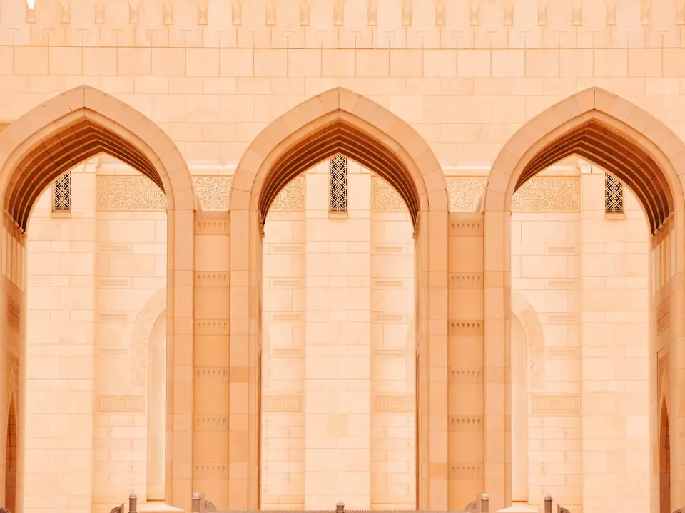 Close-up of elegant arches at the Sultan Qaboos Grand Mosque in Muscat, Oman