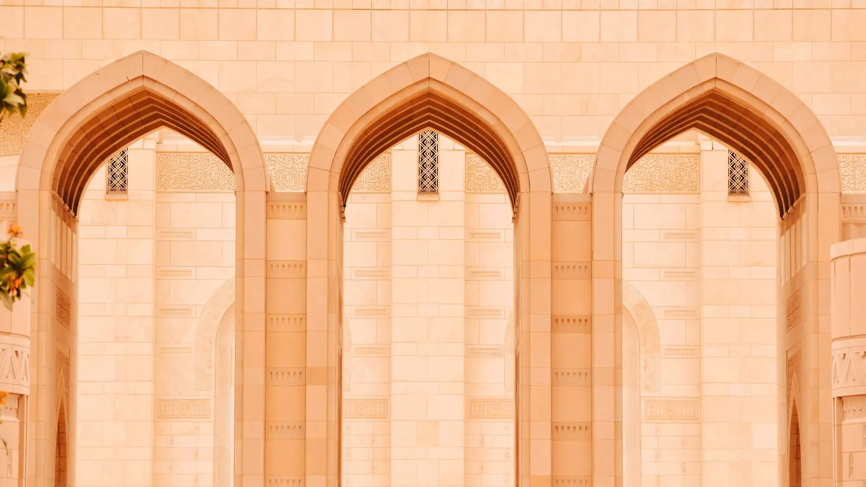 Close-up of elegant arches at the Sultan Qaboos Grand Mosque in Muscat, Oman