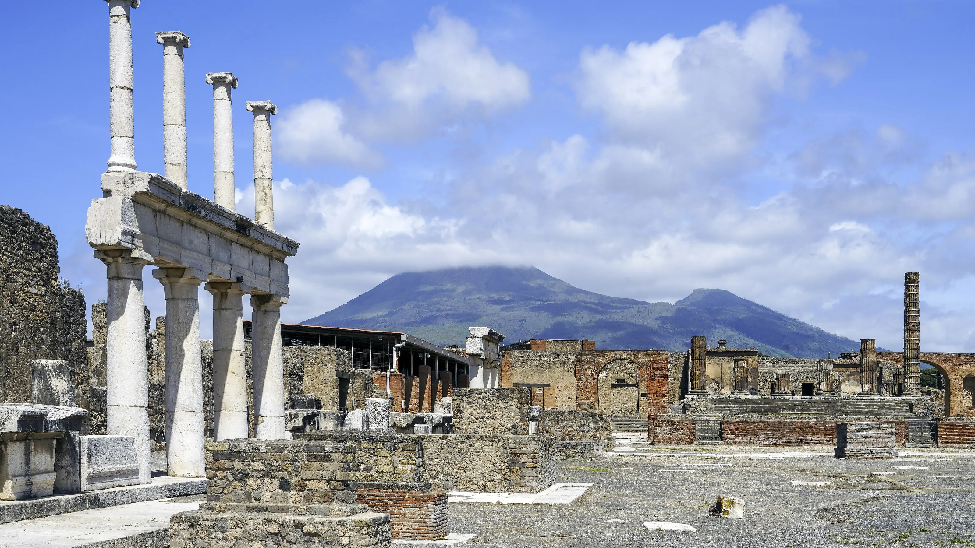 Columns of the forum at Pompeii with Vesuvius behind
