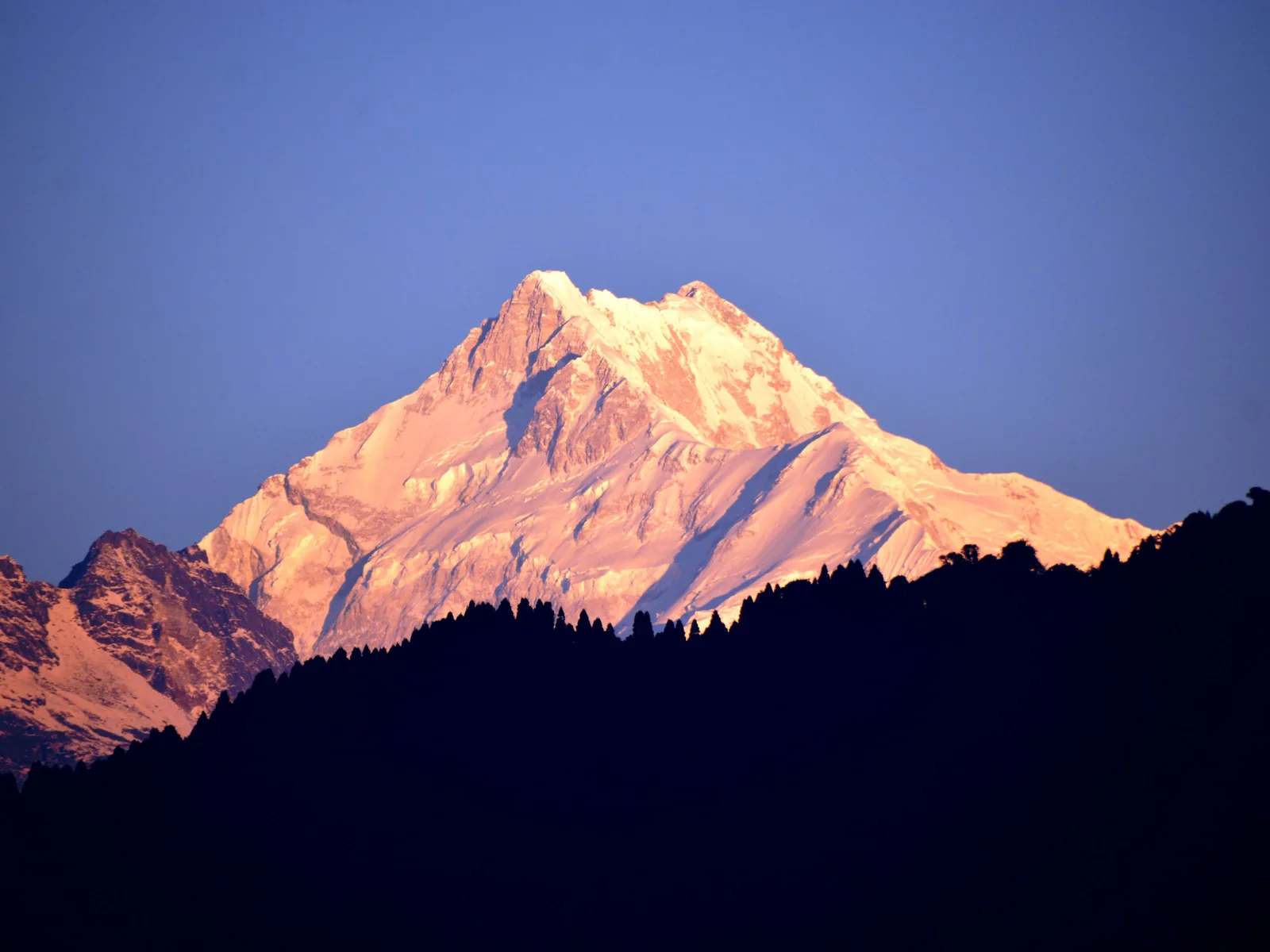 Golden sunrise over Kanchenjunga peak in the Himalayan mountain range of Sikkim, India