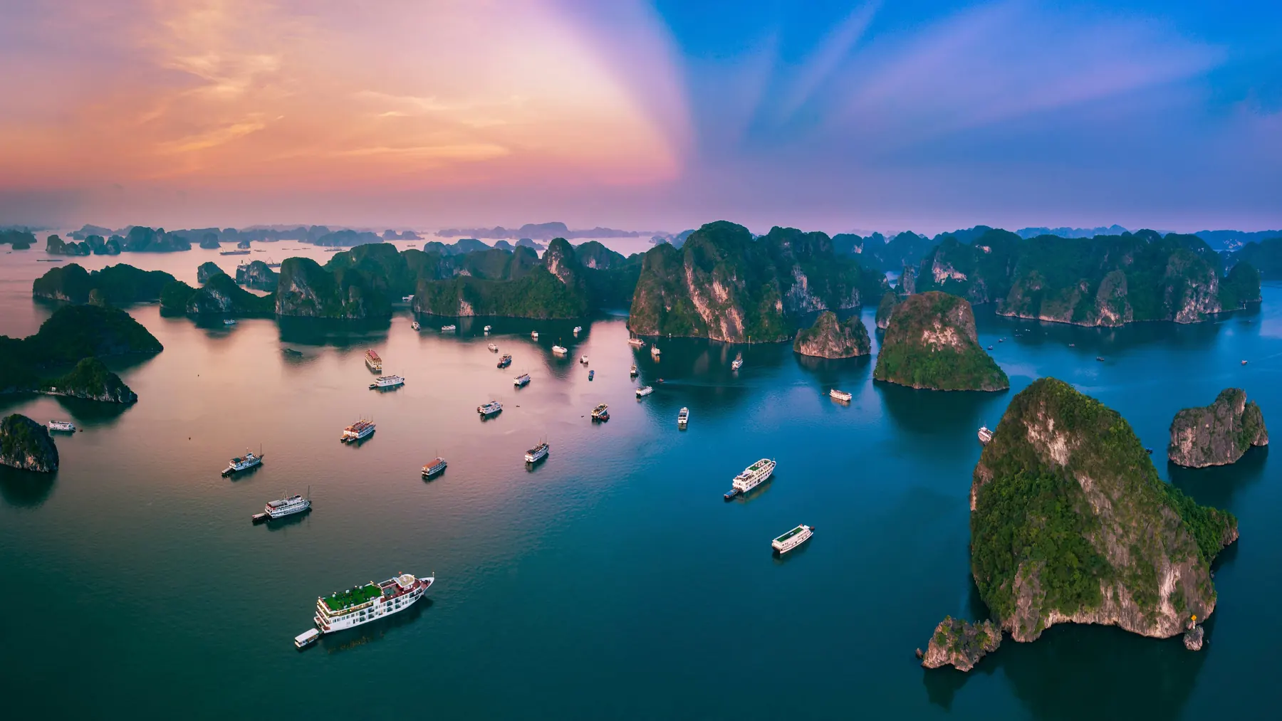 Karst islands in the ocean at sunset